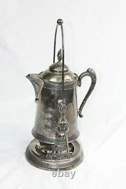 19 Th century Pairpoint Quadruple Silver Plate Handled tea pot. Made in the USA