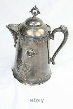 19 Th century Pairpoint Quadruple Silver Plate Handled tea pot. Made in the USA