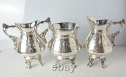 4pc Meriden Company Silverplate Footed Tea Service hand chased birds florals