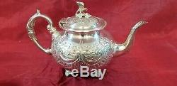 A Victorian Silver Plated Tea Set With Respoused Patterns. Bird Finials. J. Turton